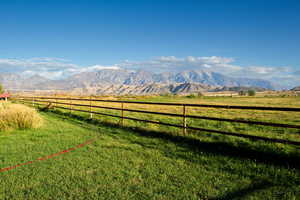 View of mountain background featuring agricultural land