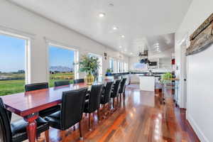 Dining room featuring dark wood finished floors and recessed lighting