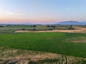 View of mountain background featuring rural landscape