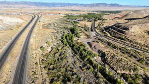View of property location with a mountainous background and a highway