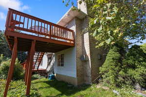 View of home's exterior featuring a deck and stairway