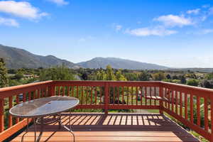 Wooden deck featuring a mountain view