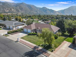 Aerial perspective of suburban area with a mountain backdrop