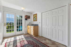 Entryway featuring a textured ceiling and tile patterned flooring
