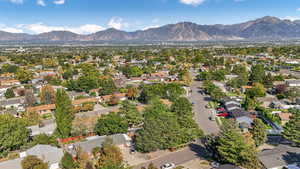Aerial perspective of suburban area featuring a mountainous background
