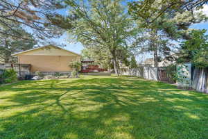 Fenced backyard with a gazebo