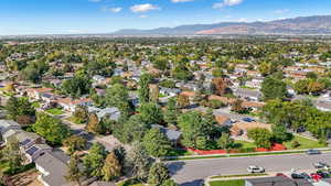 Aerial perspective of suburban area featuring a mountainous background