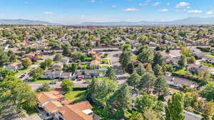 Aerial perspective of suburban area with a mountain backdrop