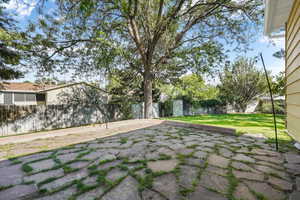 Fenced backyard featuring a patio