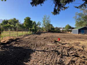 View of yard with a view of rural / pastoral area and an outdoor structure
