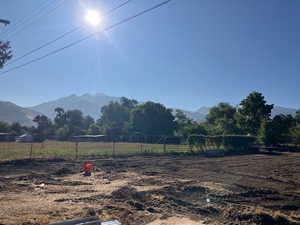View of yard featuring a view of countryside and a mountain view