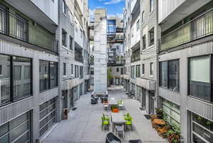 View of property's community featuring outdoor dining space.