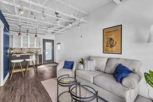 Living area featuring dark wood-type flooring