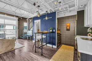 Welcome area featuring stairs and tile walls