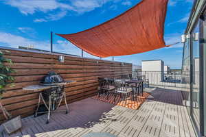 Rooftop deck with outdoor dining area