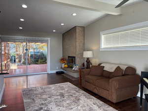 Living area featuring dark wood finished floors, recessed lighting, a ceiling fan, and a textured ceiling