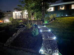 Yard at night with a lawn