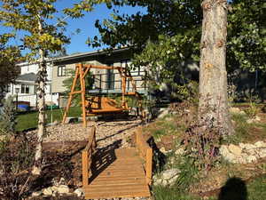 Rear view of property with a wooden deck