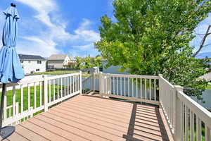 Wooden terrace featuring a residential view