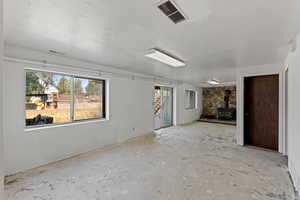 Spare room with a wood stove