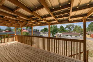 Wooden deck with a residential view