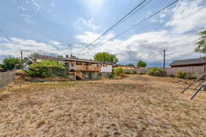 View of yard with stairway and a wooden deck