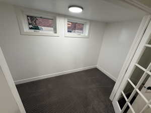 large walk in closet with french doors