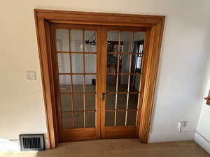 Detailed view of baseboards and french doors