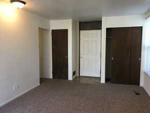 Front room with 2 closets and entry door