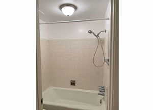 Tub and toilet in separate room from bathroom sink