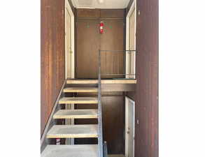 Staircase to front doors, outside HVAC at each unit