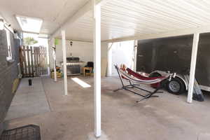 View of patio featuring a grill