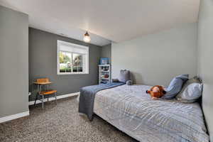 Bedroom 4 with carpet floors and baseboards