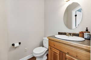 Bathroom featuring vanity and toilet