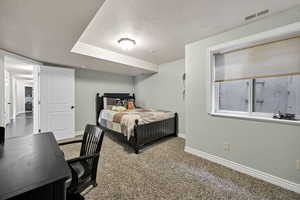 Carpeted bedroom 3 featuring baseboards and a textured ceiling