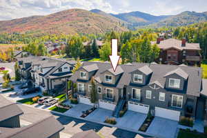 Aerial perspective of suburban area with mountains