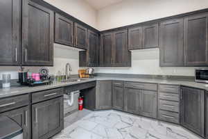 Clubhouse has games table, TV, full kitchen, lounge space and community bulletin board