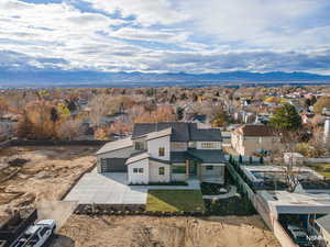 Aerial perspective of suburban area with a mountainous background