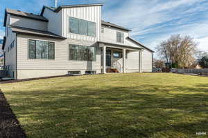 Back of property featuring board and batten siding