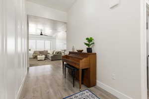 Hallway with light wood-style floors