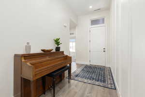 Entrance foyer featuring light wood-type flooring and baseboards