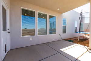View of patio with a trampoline