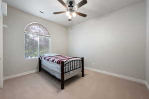 Bedroom featuring carpet and a ceiling fan