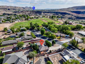 Aerial view of residential area featuring a mountainous background