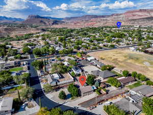 Aerial perspective of suburban area featuring a mountainous background