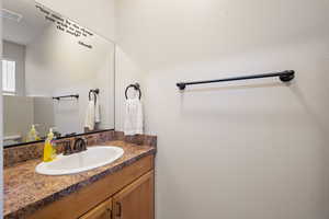 Bathroom with vanity and toilet