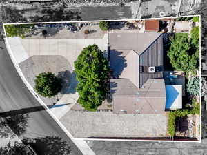 Aerial view of property and surrounding area featuring property parcel outlined