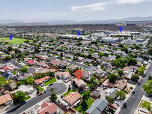 Aerial perspective of suburban area featuring a mountain backdrop