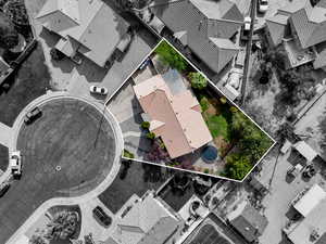 Aerial perspective of suburban area featuring property parcel outlined