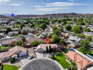 Aerial view of residential area featuring a mountain backdrop